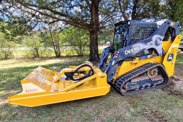 Heavy-duty skid steer rotary cutter in yellow